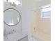 Clean bathroom with a marble vanity and a shower/tub combo at 7309 Night Heron Dr, Land O Lakes, FL 34637