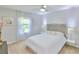 Bright bedroom with plush bedding and stylish decor at 7309 Night Heron Dr, Land O Lakes, FL 34637