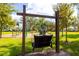 Community playground with swings and play equipment at 7309 Night Heron Dr, Land O Lakes, FL 34637