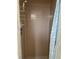 Bathroom shower stall featuring tile surround, shower head, and storage shelves at 7998 115Th St, Seminole, FL 33772