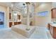 Large luxury bathroom featuring pillars, mural, chandelier and and sinks at 8510 Kentucky Derby Dr, Odessa, FL 33556