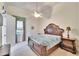 Classic bedroom featuring a carved-wood bed, neutral carpet and walls, and classic nightstand at 8510 Kentucky Derby Dr, Odessa, FL 33556