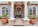 Grand entrance featuring elegant columns, arched windows, and a stunning double-door entry at 8510 Kentucky Derby Dr, Odessa, FL 33556