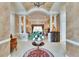 Expansive foyer showcasing columns, high ceilings, and an open view into the adjacent living room at 8510 Kentucky Derby Dr, Odessa, FL 33556