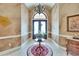 Elegant foyer with tile flooring, chandelier, and a view of the decorative double-door entry at 8510 Kentucky Derby Dr, Odessa, FL 33556