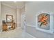 Hallway view with decorative furniture and floral accents creating a welcoming atmosphere at 8510 Kentucky Derby Dr, Odessa, FL 33556