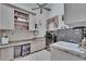 Functional laundry room with ample counter space, cabinets, and modern washer and dryer at 8510 Kentucky Derby Dr, Odessa, FL 33556