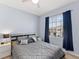 Bedroom featuring carpet flooring, a bed with decorative pillows and a large window at 8617 Falling Blue Pl, Riverview, FL 33578