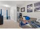 Bedroom featuring carpet flooring, closet, bed with decorative pillows and sports memorabilia at 8617 Falling Blue Pl, Riverview, FL 33578