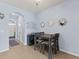 Eat-in dining area featuring tile flooring, a modern light fixture, and an arched doorway to the entry at 8617 Falling Blue Pl, Riverview, FL 33578