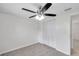 Bright bedroom with a ceiling fan, closet, and neutral carpet at 9013 Tree Valley Cir, Tampa, FL 33615