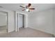 Bedroom with tiled floor, standard closet and ceiling fan at 9013 Tree Valley Cir, Tampa, FL 33615