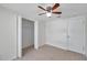 Tiled bedroom with closet and ceiling fan at 9013 Tree Valley Cir, Tampa, FL 33615