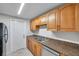 Functional kitchen with stainless steel sink and ample countertop space at 9013 Tree Valley Cir, Tampa, FL 33615