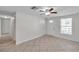 Bright living room featuring tile flooring, white walls, and ample natural light at 9013 Tree Valley Cir, Tampa, FL 33615