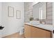 A modern half bathroom featuring a stylish vanity, vessel sink, decorative wall tiles, and sleek fixtures at 910 W West St, Tampa, FL 33602