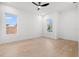 Bright, empty bedroom with hardwood floors, neutral paint, and a ceiling fan at 910 W West St, Tampa, FL 33602