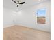 Spacious, empty bedroom with hardwood floors, neutral paint, and a ceiling fan at 910 W West St, Tampa, FL 33602