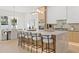 Stylish kitchen island featuring seating for four and gorgeous counter lighting at 910 W West St, Tampa, FL 33602