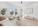 Living room with modern furnishings, neutral decor, and large windows at 910 W West St, Tampa, FL 33602