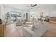 Bright living room featuring modern furniture, a view to the kitchen and dining, and sliding doors at 910 W West St, Tampa, FL 33602