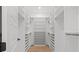 Spacious walk-in closet featuring custom shelving and hanging rods for optimal organization and storage at 910 W West St, Tampa, FL 33602