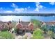 Aerial view of colorful townhomes in the Lake Chase community with a lake view at 9142 Lake Chase Island Way, Tampa, FL 33626