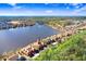 Scenic aerial view of the community's lakeside setting with well maintained landscaping at 9142 Lake Chase Island Way, Tampa, FL 33626