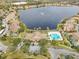 A beautiful community situated around a lake, complete with a pool and fountains at 9142 Lake Chase Island Way, Tampa, FL 33626