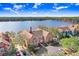 Aerial view of Lake Chase townhomes showcasing the community's attractive lakeside setting at 9142 Lake Chase Island Way, Tampa, FL 33626