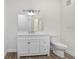 Bathroom showcasing a white vanity and a large mirror at 9142 Lake Chase Island Way # 9142, Tampa, FL 33626