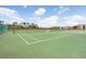 A community tennis court with green surface and clear markings at 9142 Lake Chase Island Way, Tampa, FL 33626