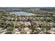 Aerial view of a neighborhood with a pond and well-maintained homes and landscaping at 10063 Celtic Ash Dr, Ruskin, FL 33573