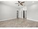 Spacious main bedroom featuring a ceiling fan, base molding, and neutral wall paint at 10063 Celtic Ash Dr, Ruskin, FL 33573