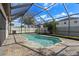 Screened-in pool with brick patio and view of fenced backyard, ideal for outdoor relaxation and enjoyment at 10063 Celtic Ash Dr, Ruskin, FL 33573