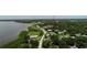 Aerial view showcases the wooded landscape of the residential neighborhood near the waterfront at 102 Brent Cir, Oldsmar, FL 34677