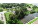 An aerial view of landscaping with a dock at 102 Brent Cir, Oldsmar, FL 34677