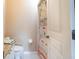 Powder room with tiled floors, granite countertop and shower curtain with a tropical theme at 102 Brent Cir, Oldsmar, FL 34677