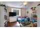 bedroom with hardwood floors, ceiling fan and ample natural light from the window at 102 Brent Cir, Oldsmar, FL 34677