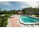 Community pool area with lounge chairs and cabana at 102 Brent Cir, Oldsmar, FL 34677