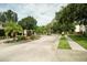 Entrance to Seaside Estates featuring brick pillars, a decorative sign, and lush landscaping at 102 Brent Cir, Oldsmar, FL 34677