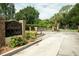 Gated entrance to Seaside Estates, with brick signage and manicured landscaping at 102 Brent Cir, Oldsmar, FL 34677