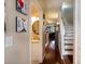 Entry hallway leading to living spaces with staircase and half bath at 102 Brent Cir, Oldsmar, FL 34677