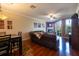 Comfortable living room with hardwood floors, a fireplace, and a sliding door to the outside at 102 Brent Cir, Oldsmar, FL 34677