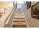 Charming staircase featuring inspirational messages inscribed on the risers, adding a touch of personality to the home at 102 Brent Cir, Oldsmar, FL 34677