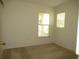 Bedroom featuring carpet flooring, a window, and neutral walls at 11818 Mango Groves Blvd, Seffner, FL 33584