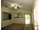 Open living room featuring neutral walls, carpet flooring, and a ceiling fan at 11818 Mango Groves Blvd, Seffner, FL 33584