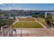 Scenic aerial view showcases Tampa's beautiful waterfront park, complete with lush lawns, trees, and city views at 1440 Harbour Walk Rd, Tampa, FL 33602