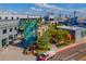 Aerial shot of Sparkman Wharf, a vibrant outdoor area, featuring shops, restaurants, and the SS American Victory ship at 1440 Harbour Walk Rd, Tampa, FL 33602