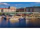 Picturesque waterfront view with yachts docked at a harbor surrounded by buildings and dining establishments at 1440 Harbour Walk Rd, Tampa, FL 33602